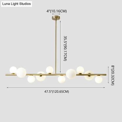 Modern gold metal glass globe chandelier with sleek horizontal bar and chain cord length for dining table lighting