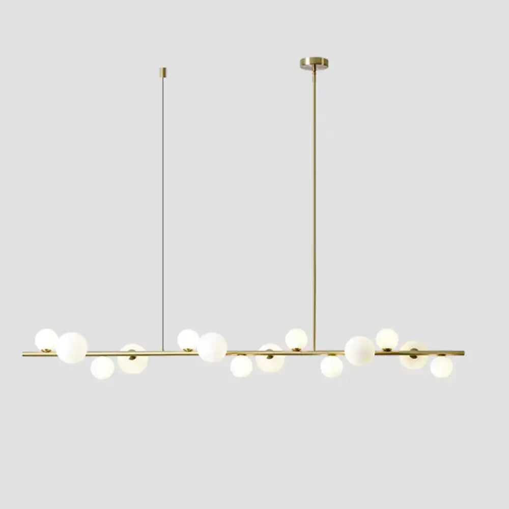 Modern gold metal glass globe chandelier with sleek horizontal bar and chain cord length for dining table lighting
