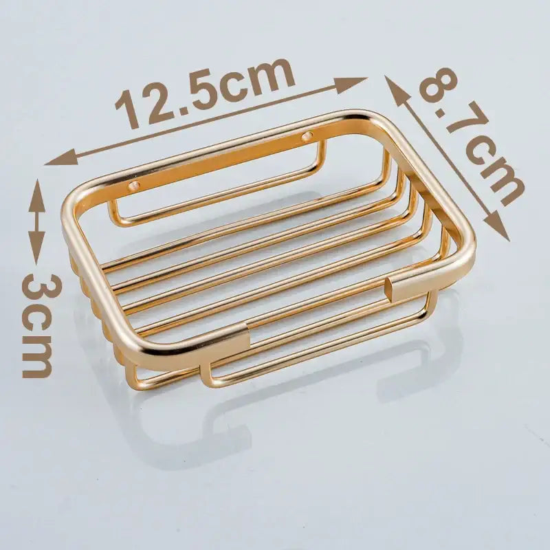 Modern gold metal glass soap dish with rectangular slatted design for bathroom wall mounted use