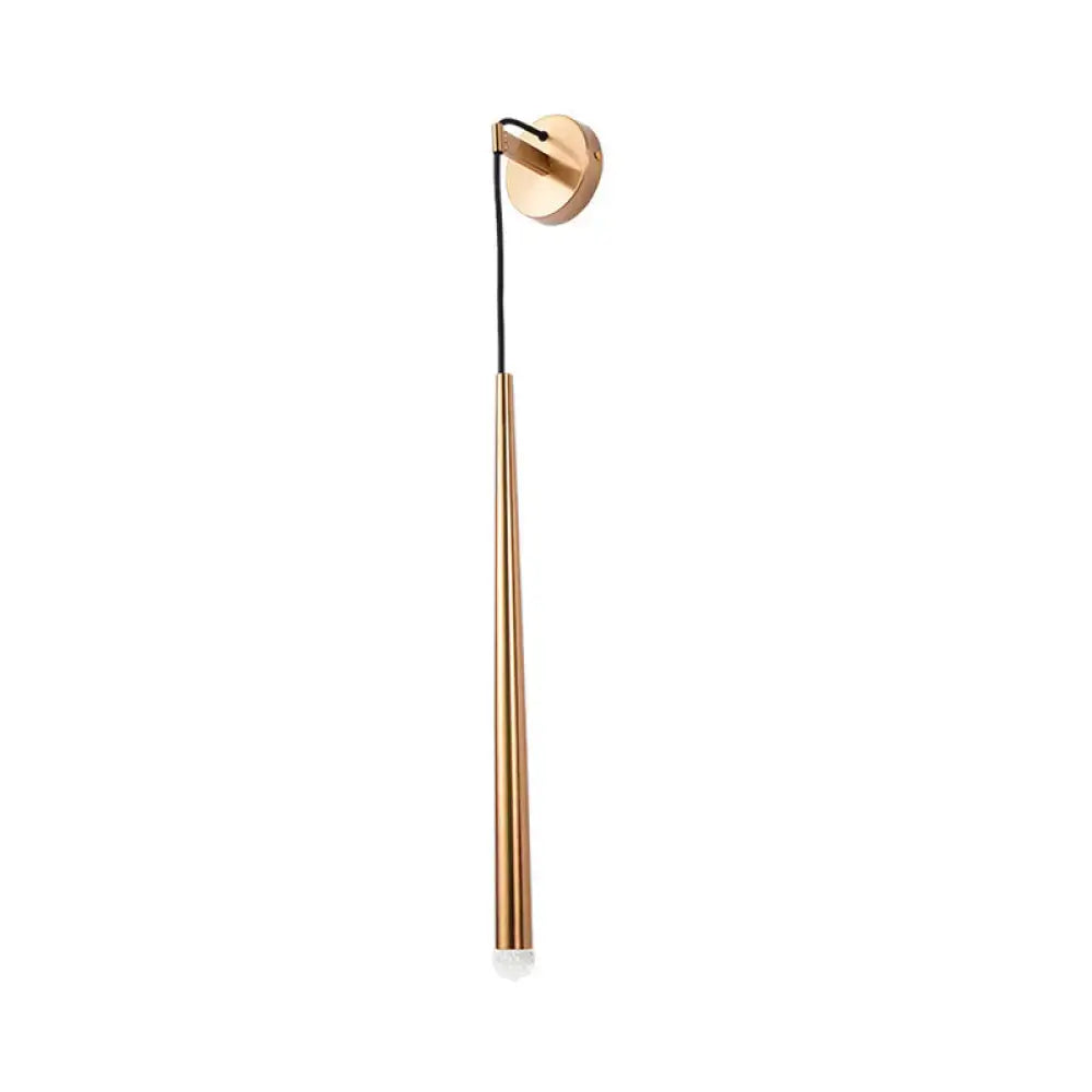 A sleek modern wall-mounted led sconce with a slender copper metal shade and brass base for 110v-120v use