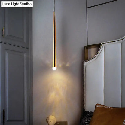 A modern gold metal shade led sconce with slender cylindrical design and warm glow for 110v-120v living room use