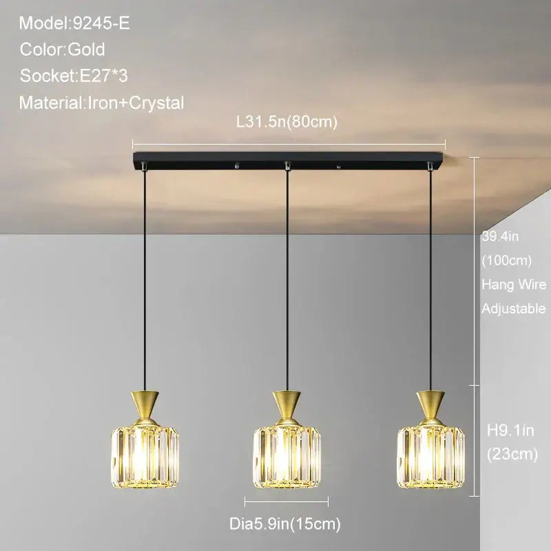 Modern gold mini crystal pendant light with three crystal-encased bulbs on iron bar for bedroom decorbites gold mini chandelier