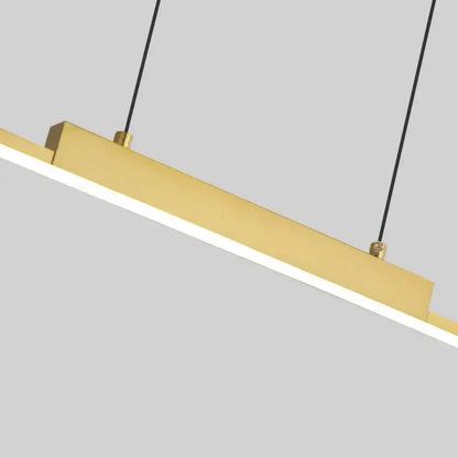 Modern gold rectangular pendant light with sleek black cords featuring dimmable led light source for dining room