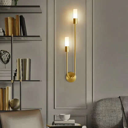 Modern gold minimalist led wall lamp with two frosted glass shades and curved metal arm for bedroom vertical wall sconce