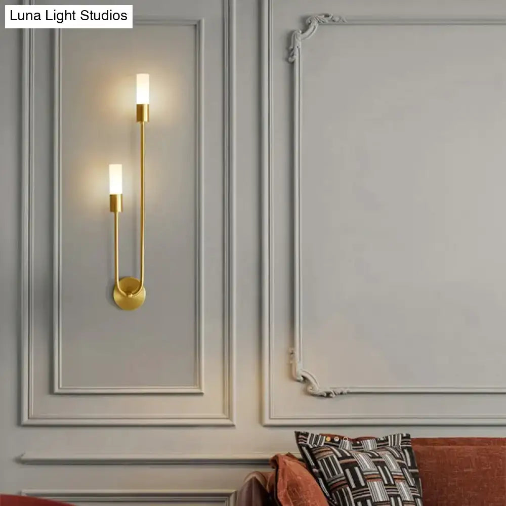 Modern gold minimalist led wall lamp with two vertical candle-style lights and curved design for bedroom wall lamp