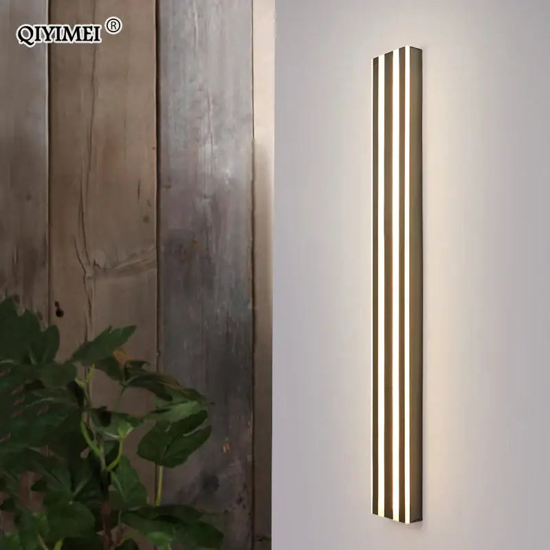 Modern gold minimalist led wall lamp with three vertical warm light strips for bedroom and exterior corridor decorbites led wall
