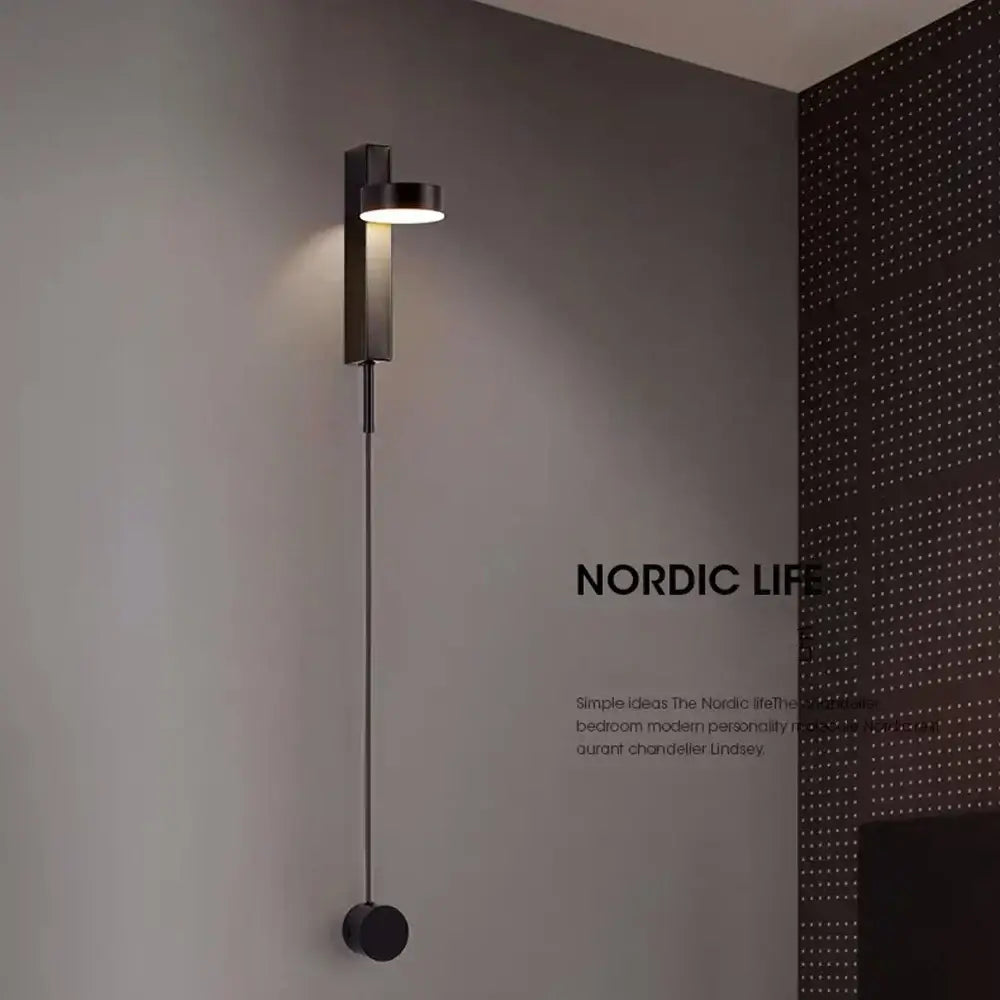 Black minimalist led wall lamp with cylindrical head and slender stem for modern living room art lighting