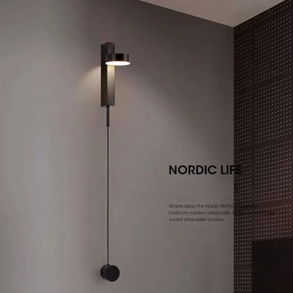 Black minimalist led wall lamp with cylindrical head and slender stem for modern living room art lighting