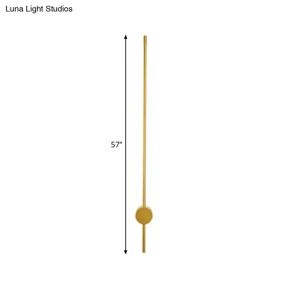 A sleek 57 inch tall brass wall light with minimalist design and fixture height ideal for modern bedroom lighting