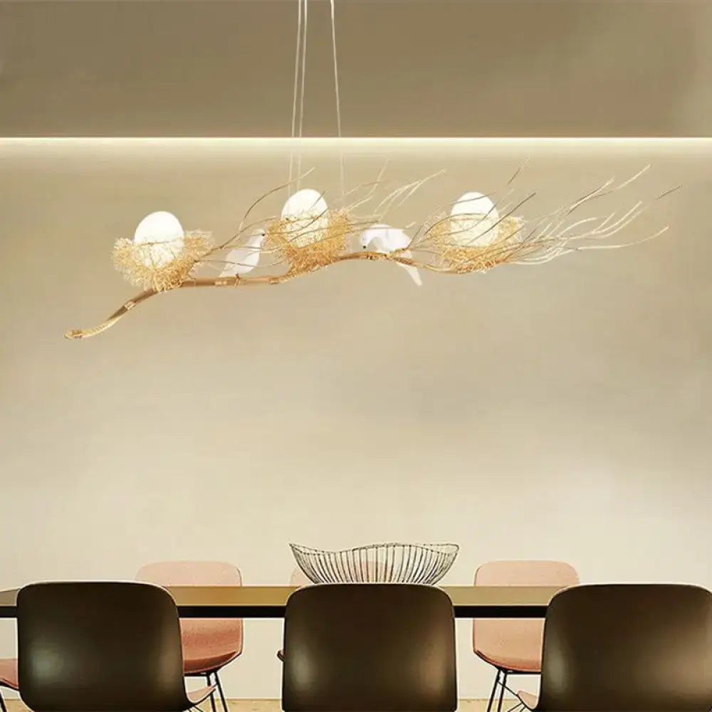 Decorbites™ modern gold nest island pendant chandelier with three white bird figurines on a gold nest design