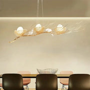 Decorbites™ modern gold nest island pendant chandelier with three white bird figurines on a gold nest design