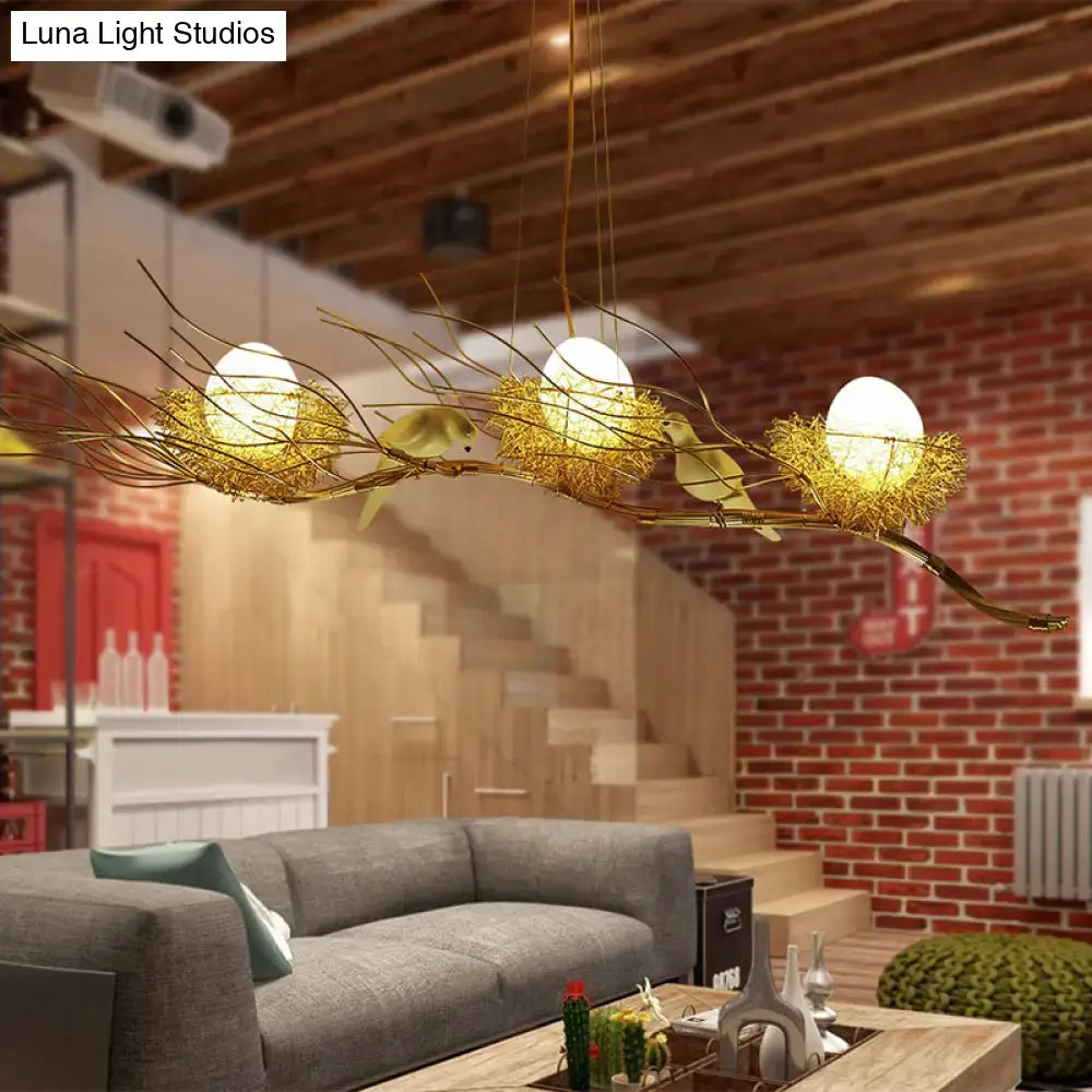 Decorbites™ modern gold nest island pendant chandelier with three glowing egg-shaped lights in woven nest metal design