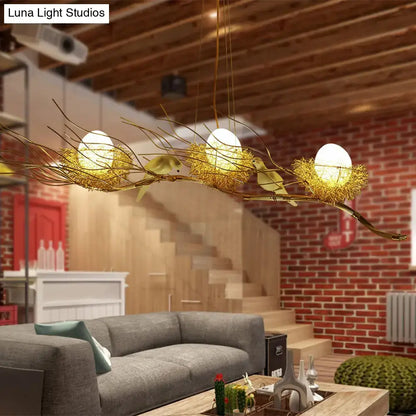 Decorbites™ modern gold nest island pendant chandelier with three glowing egg-shaped lights in woven nest metal design