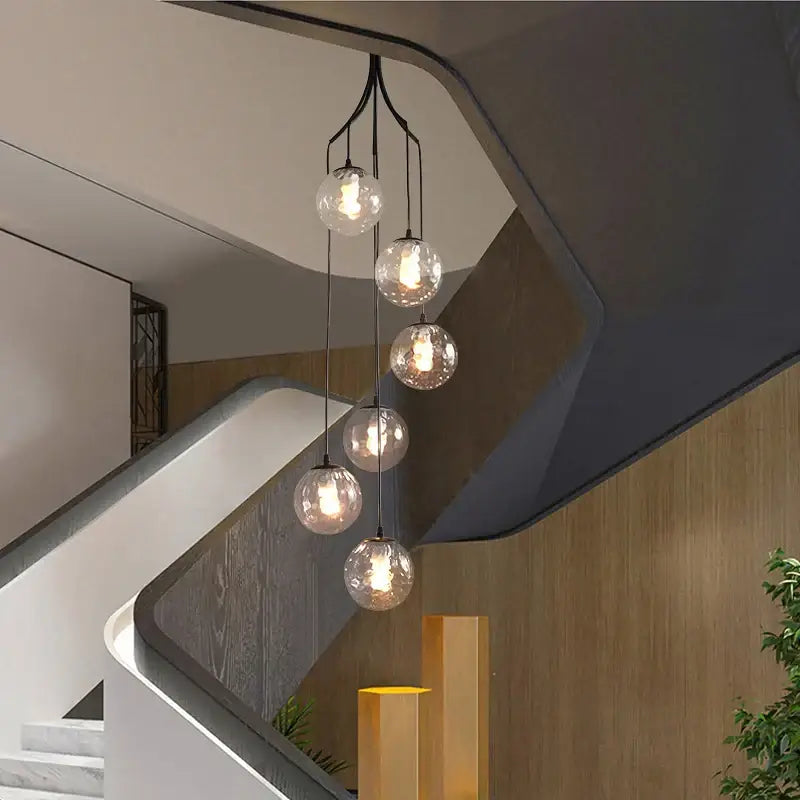Modern gold nordic pendant light with five clear glass spheres and black metal arms for dining room decorbites gold nordic