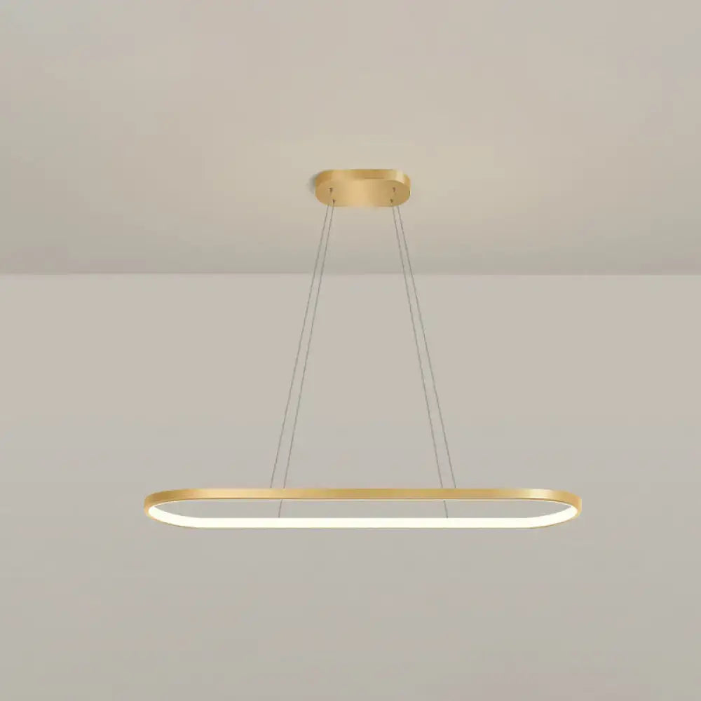 Modern gold oblong pendant light fixture with integrated led lighting and adjustable chain cord length in warm white color