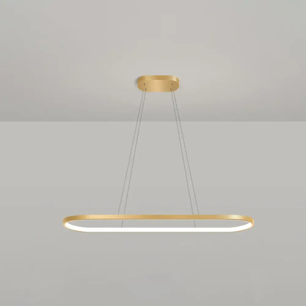 Modern gold oblong pendant light fixture with integrated led lighting and adjustable chain cord length in warm white color