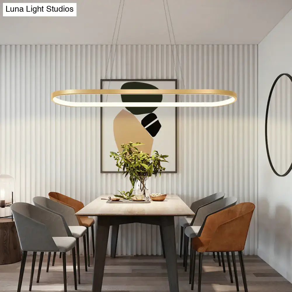 Modern gold oblong pendant light fixture with sleek frame, integrated led lighting, and adjustable chain cord length in warm white color