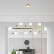 Modern gold hotel ceiling pendant with opal glass spherical shades and fixture width featuring eight lights