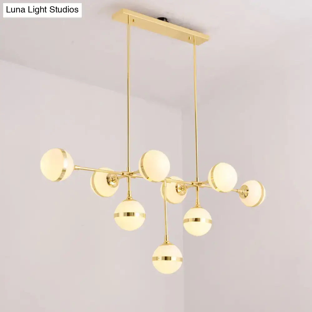 DecorBites™ modern orb chandelier with nine silver gold bulb base heads and frosted glass shades ideal for restaurants and hotels