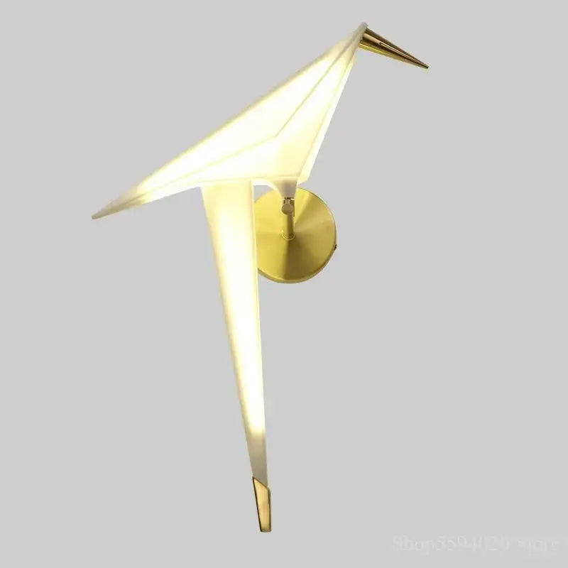 Modern gold origami bird led wall lamp with translucent white body and metal accents for bedroom or living room use