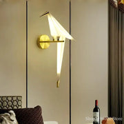 Modern gold origami bird led wall lamp with gold-toned minimalist design and softly glowing white light for bedroom or living room