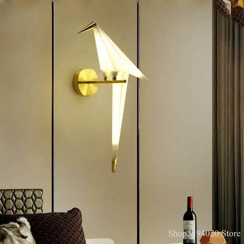 Modern gold origami bird led wall lamp with gold-toned minimalist design and softly glowing white light for bedroom or living room