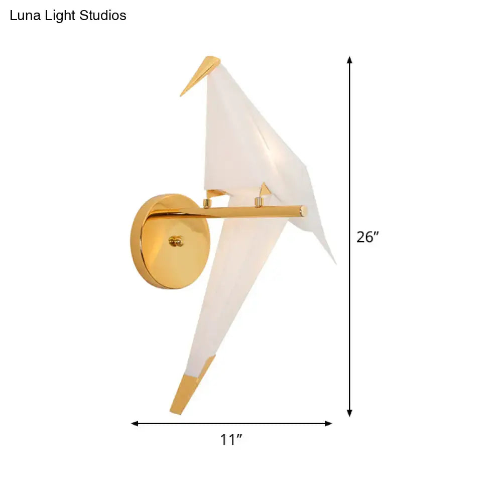 Modern gold origami bird led wall sconce with a translucent white paper-like body and metallic accents for bedroom lighting