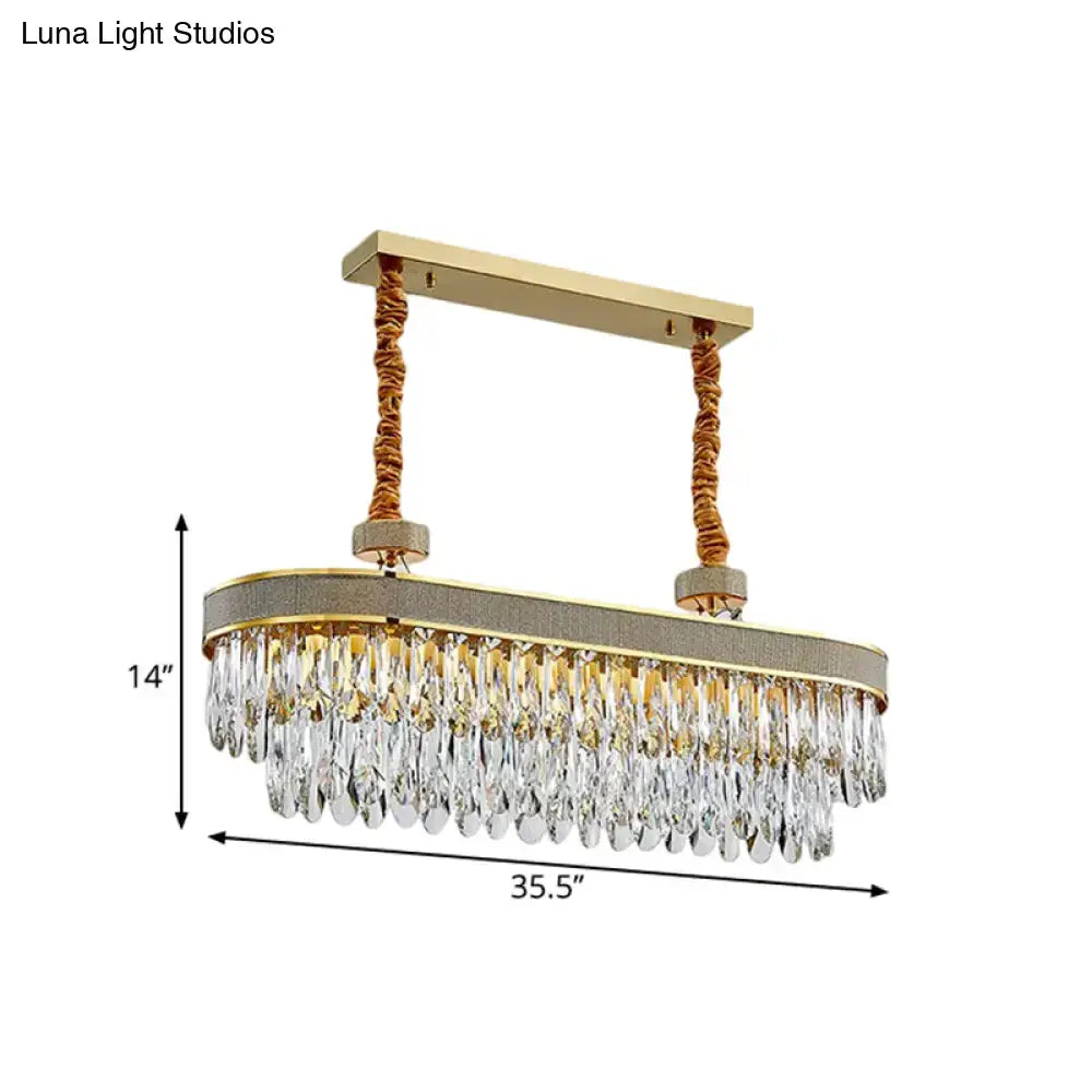 Gold-toned led island chandelier with cascading oval clear crystal drops and braided cords ceiling light fixture