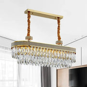 Decorbites golden led island chandelier with gold-toned oval clear crystal drops and textured gray fabric band ceiling light