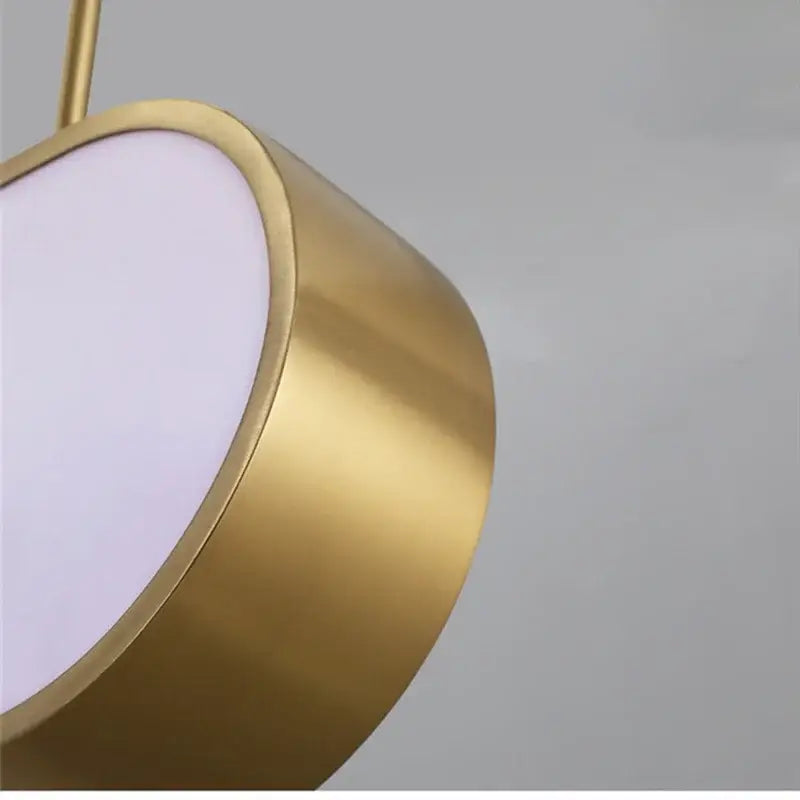 Modern gold oval decorbites led sunset chandelier featuring a gold-toned cylindrical pendant with diffused white light