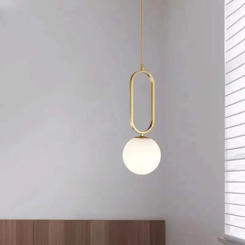 Modern gold oval pendant light featuring a frosted glass ball ideal for dining room decorbites pendant lights