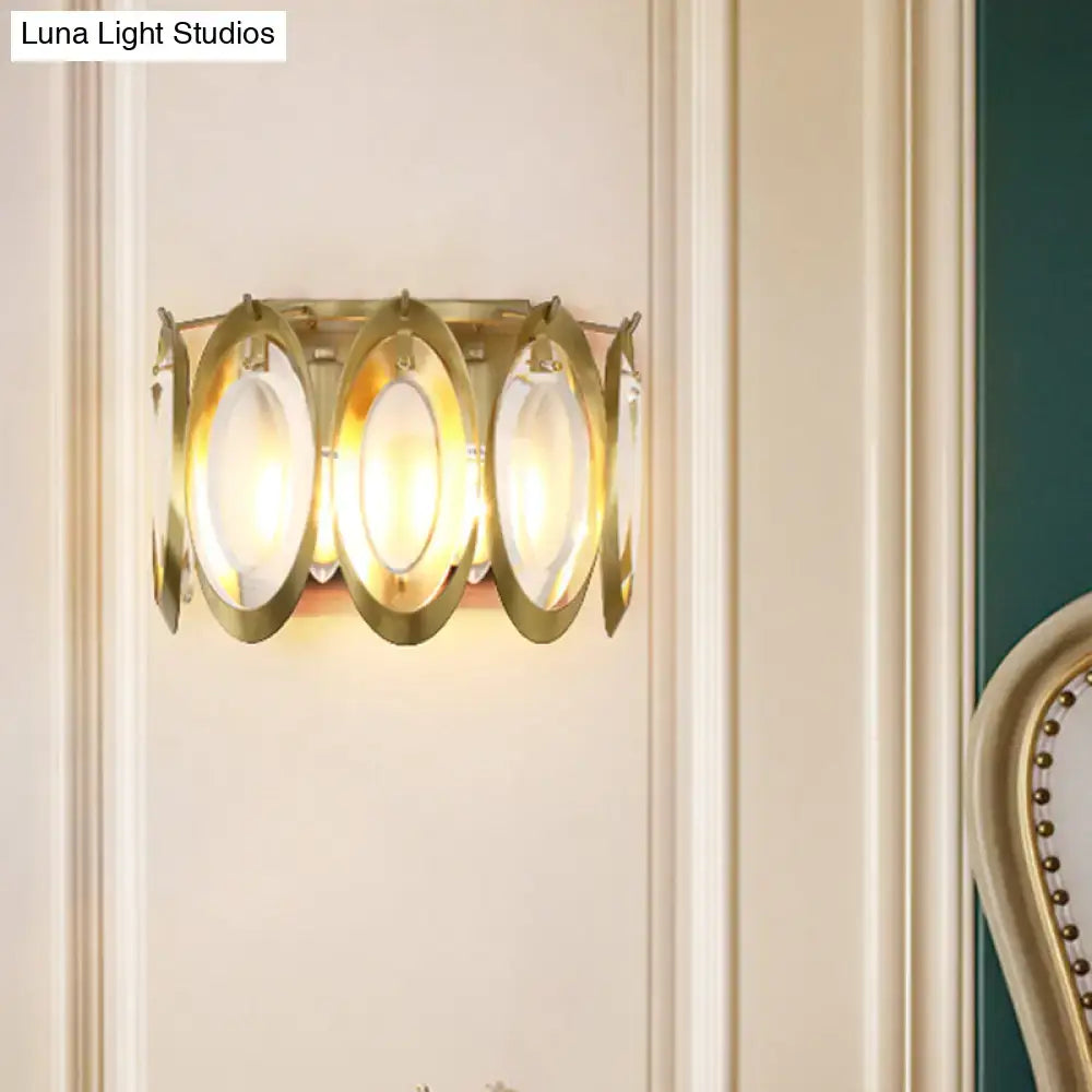 Modern gold oval sconce light with three frosted glass panels framed by circular metal rings for living room wall use