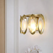 Modern gold oval sconce light with three glass panels and sleek design for living room wall fixture
