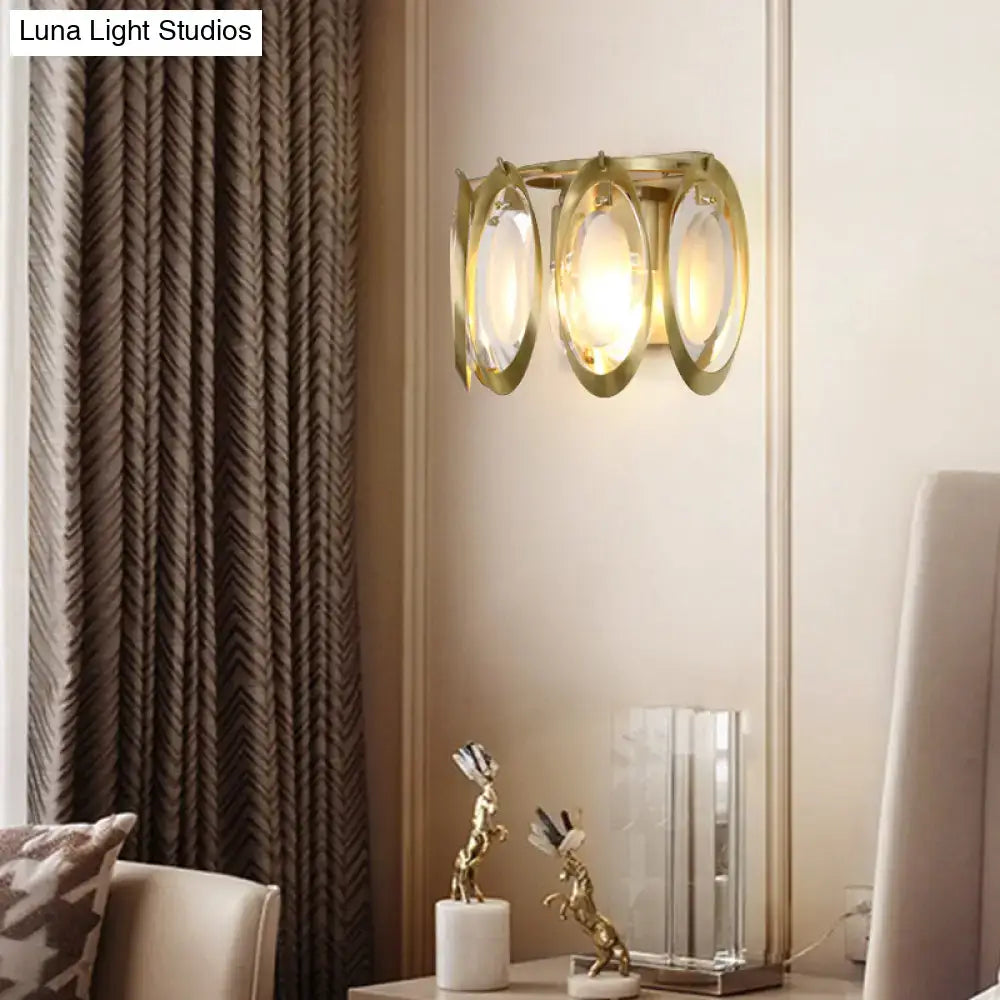 Modern gold oval sconce light with three circular glass shades for living room wall fixture in gold tone