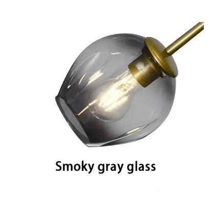 Modern gold painted metal pendant light with smoky gray glass shade and brass finish for dining room lighting