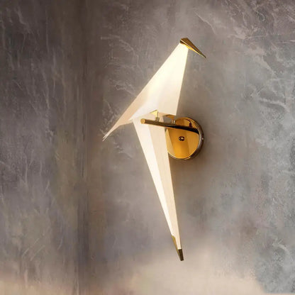 Modern gold-toned wall lamp dining room sconce with sleek origami design and frosted birdie plastic shade