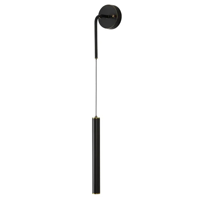Black cylindrical wall sconce with gold-toned accents in modern gold pendant and wall sconce set for bedroom lighting