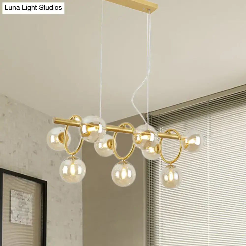 DecorBites Nordic style gold pendant light with clear cognac glass bubble bulbs suspended by white cords