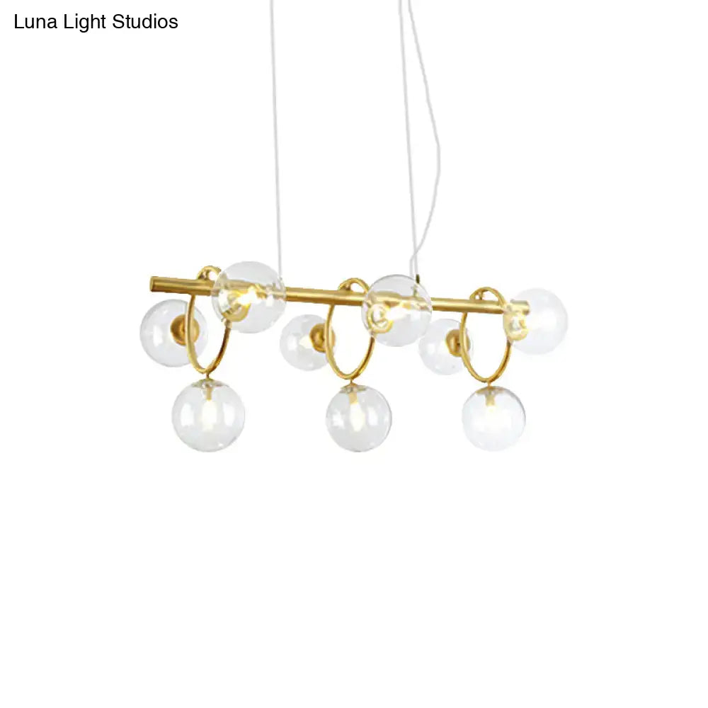 Decorbites™ nordic style gold pendant light with clear cognac glass spheres suspended by circular metal rings