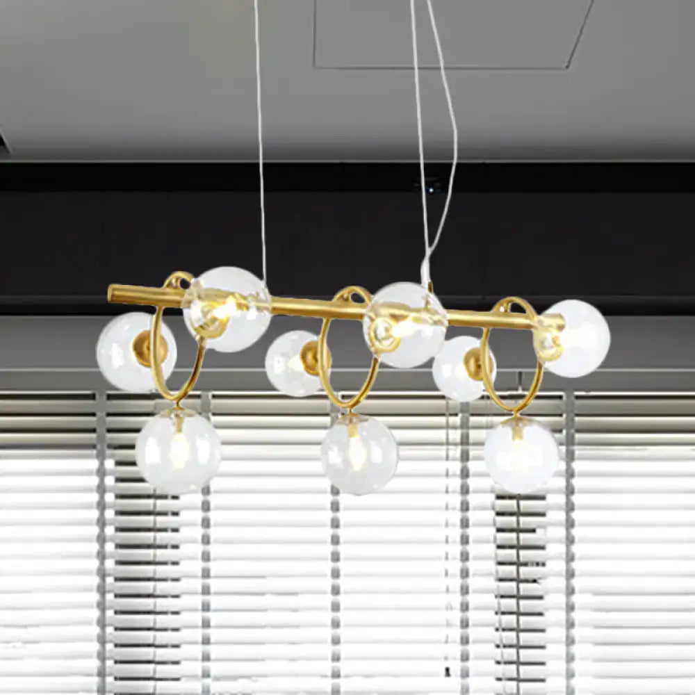 DecorBites™ nordic style gold pendant light with clear cognac glass globes and white cords in modern design