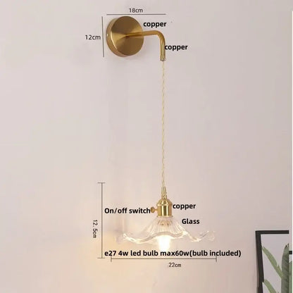 Modern gold petal led wall lights feature a brass finish with curved arm and clear glass shade for elegant decorbites led wall lighting