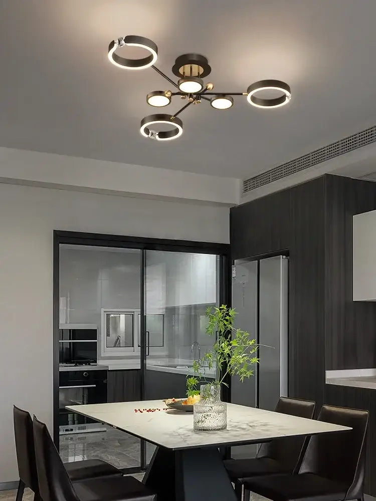 Modern black and brass gold plated chandelier with illuminated circular rings for living room decorbites gold plated lighting