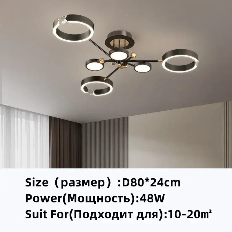 Modern gold plated chandelier with black arms and illuminated rings by decorbites gold plated for living room decor