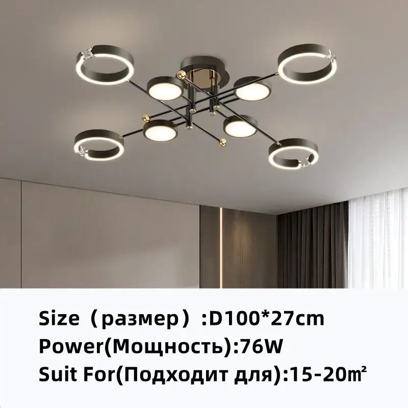 Modern gold plated chandelier with black arms featuring circular rings and glowing led bulbs for living room decorbites gold plated