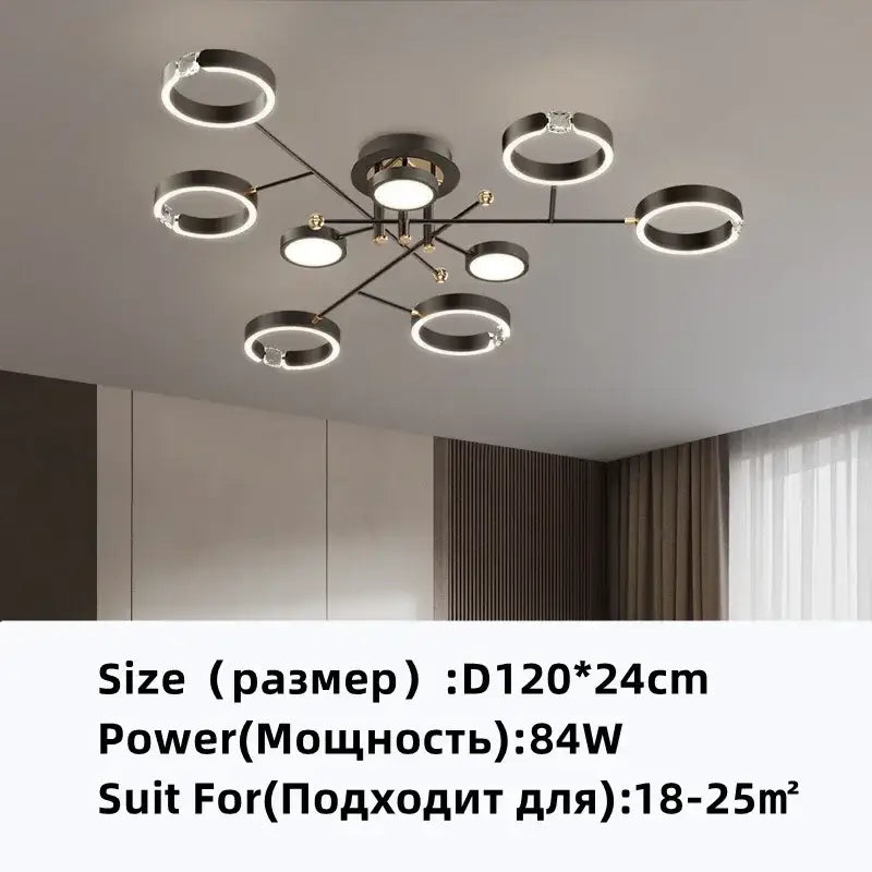 Modern gold plated chandelier with black arms and illuminated circular lights from decorbites gold plated collection