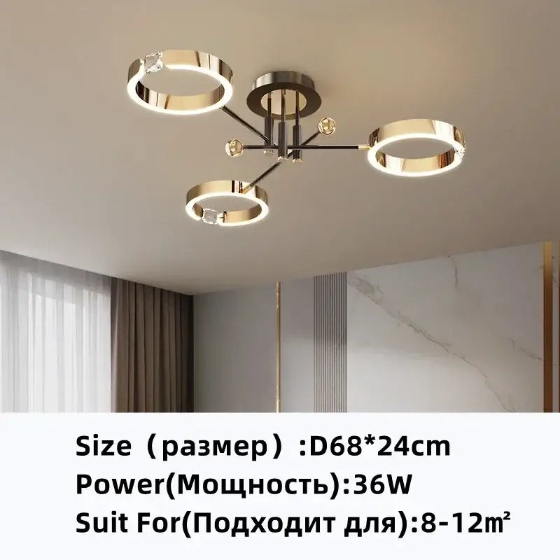 Modern gold plated chandelier with black arms featuring a gold toned circular ceiling light with crystal accents decorbites gold plated