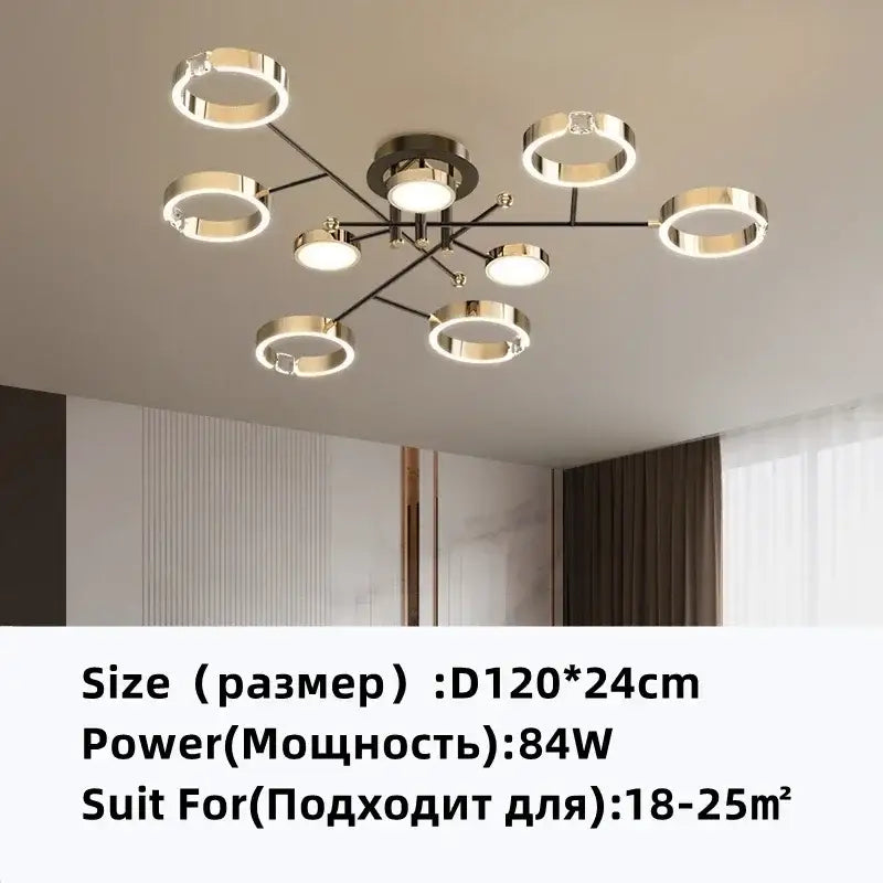 Modern gold plated chandelier with black arms featuring a circular pendant light with illuminated rings by decorbites gold plated