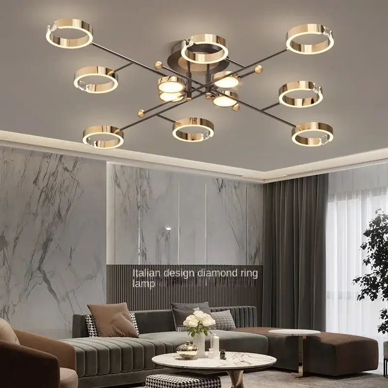 Modern gold plated chandelier with sleek black arms and circular ring lights for living room decorbites gold plated design