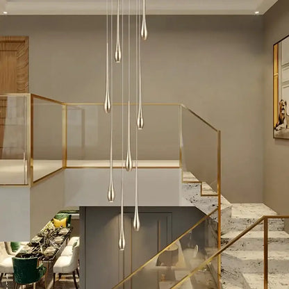 Modern chandeliers featuring elegant silver teardrop pendant lights complement decorbites gold-plated modern designs
