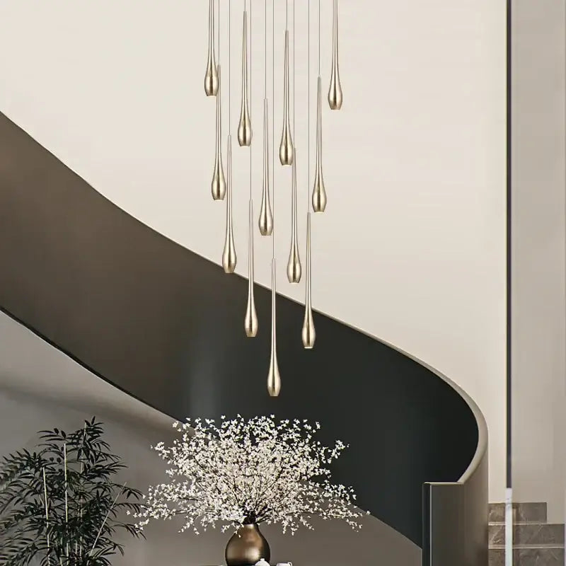 Modern chandeliers featuring a decorbites gold-plated modern pendant with slender teardrop fixtures in cascading design